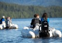 Photo of guests navigating their boat